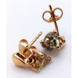 A PAIR OF HEART SHAPED 9K GOLD STONE SET EARRINGS . 1.9gms