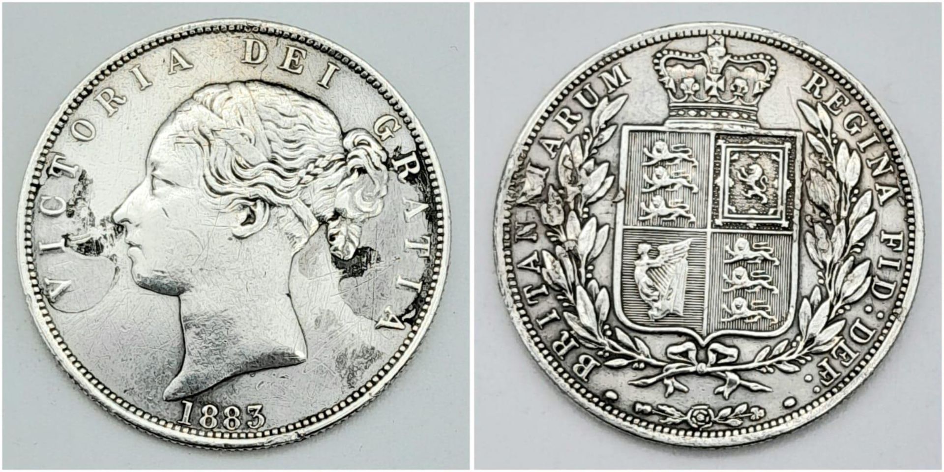 An 1883 Queen Victoria Silver Half Crown. Unfortunately some surface damage on obverse.