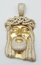 An 18K Yellow Gold Jesus Encrusted Diamond Pendant. Beautifully crafted with 7ctw of bright white