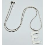 A 925 silver initial E pendant on silver chain. Total weight 5.7G. Total length 42cm.