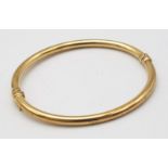 9K YELLOW GOLD BANGLE (SMALL INSIDE DENT) - 5.5G TOTAL WEIGHT - 6CM DIAMETER