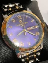 Gentlemans ON THE EDGE Quartz Wristwatch. Day/date model, having royal blue face with golden Roman