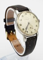 A Rare Peerex Vintage Mechanical Gents Watch. Brown leather strap. Stainless steel case - 33mm.