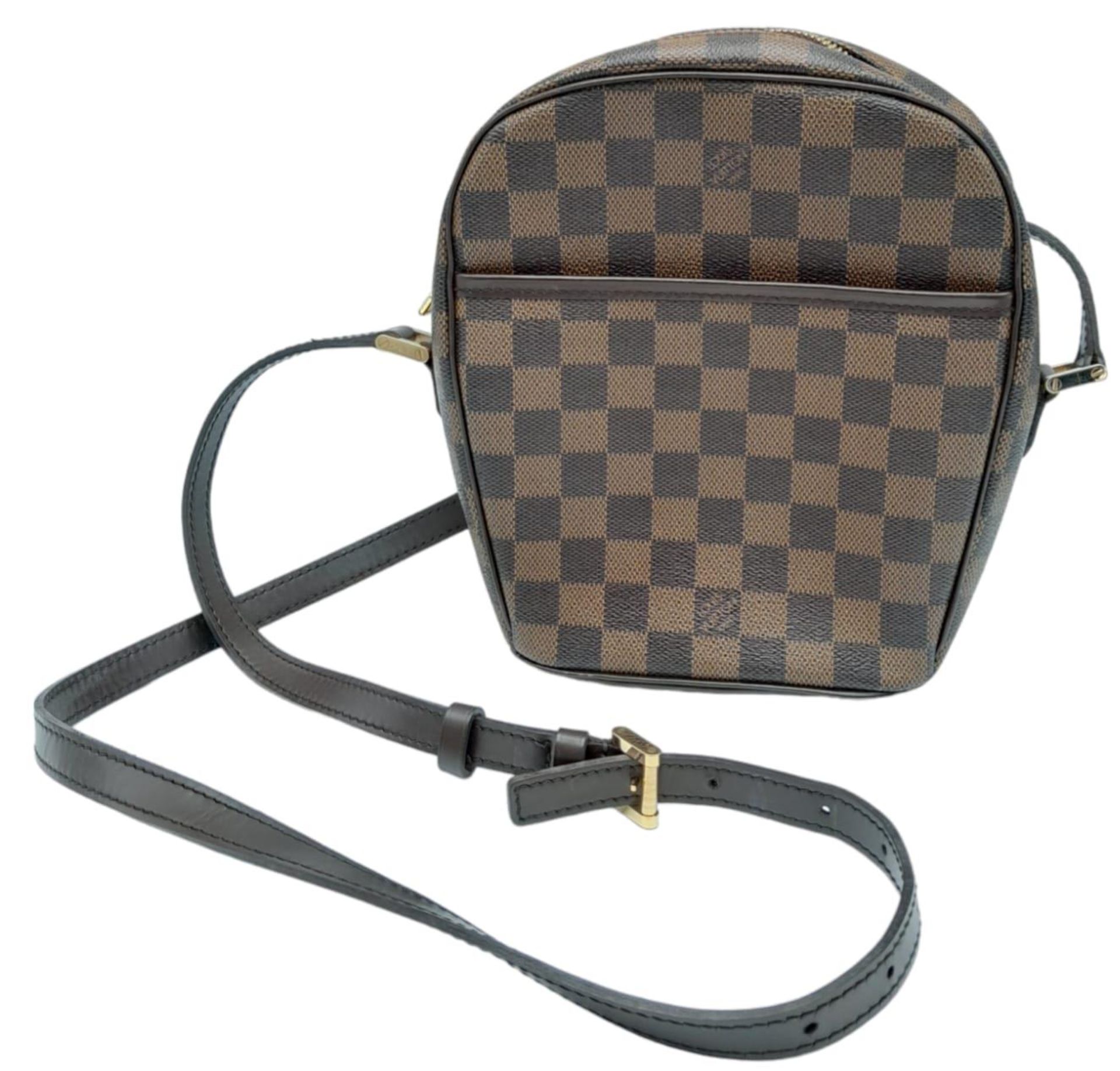 A Louis Vuitton Damier Ebene 'Ipanema' Crossbody Bag. Leather exterior with gold-toned hardware,