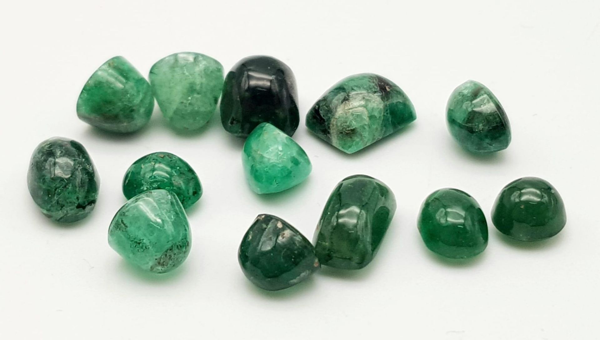 A Parcel of 13 Colombian Emerald Cabochons. 25.65 Carats Total. - Image 2 of 3