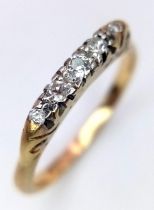 AN ANTIQUE 18K GOLD RING WITH 5 DIAMONDS . 2.8gms size Q