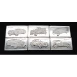 A SELECTION OF 6 STERLING SILVER BEST OF BRITISH CAR MANUFACTURERS MINI PLAQUES WITH LOGO AND CARS