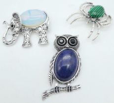 Three Gemstone Animal Brooches - Lapis Owl, Marcasite Spider and an Opalite Elephant. All 4.5cm.