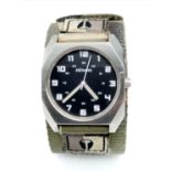 A Men’s Nixon Military Watch. 38mm Including Crown on Camouflage Combat Strap. Scout Model. Full