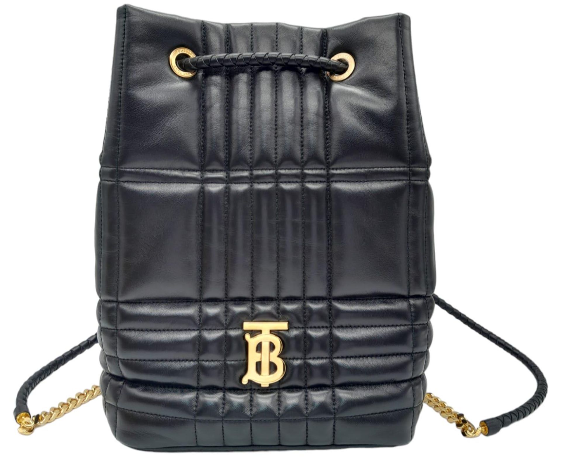 A Burberry Black 'Lola' Backpack. Quilted leather exterior with gold-toned hardware, chain and