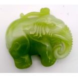 A Chinese Green and White Jade Elephant Pendant. 5 x 4.5cm.