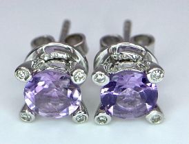 A PAIR OF 18K WHITE GOLD DIAMOND & AMETHYST STUD EARRINGS. TTOAL WEIGHT 2.9G