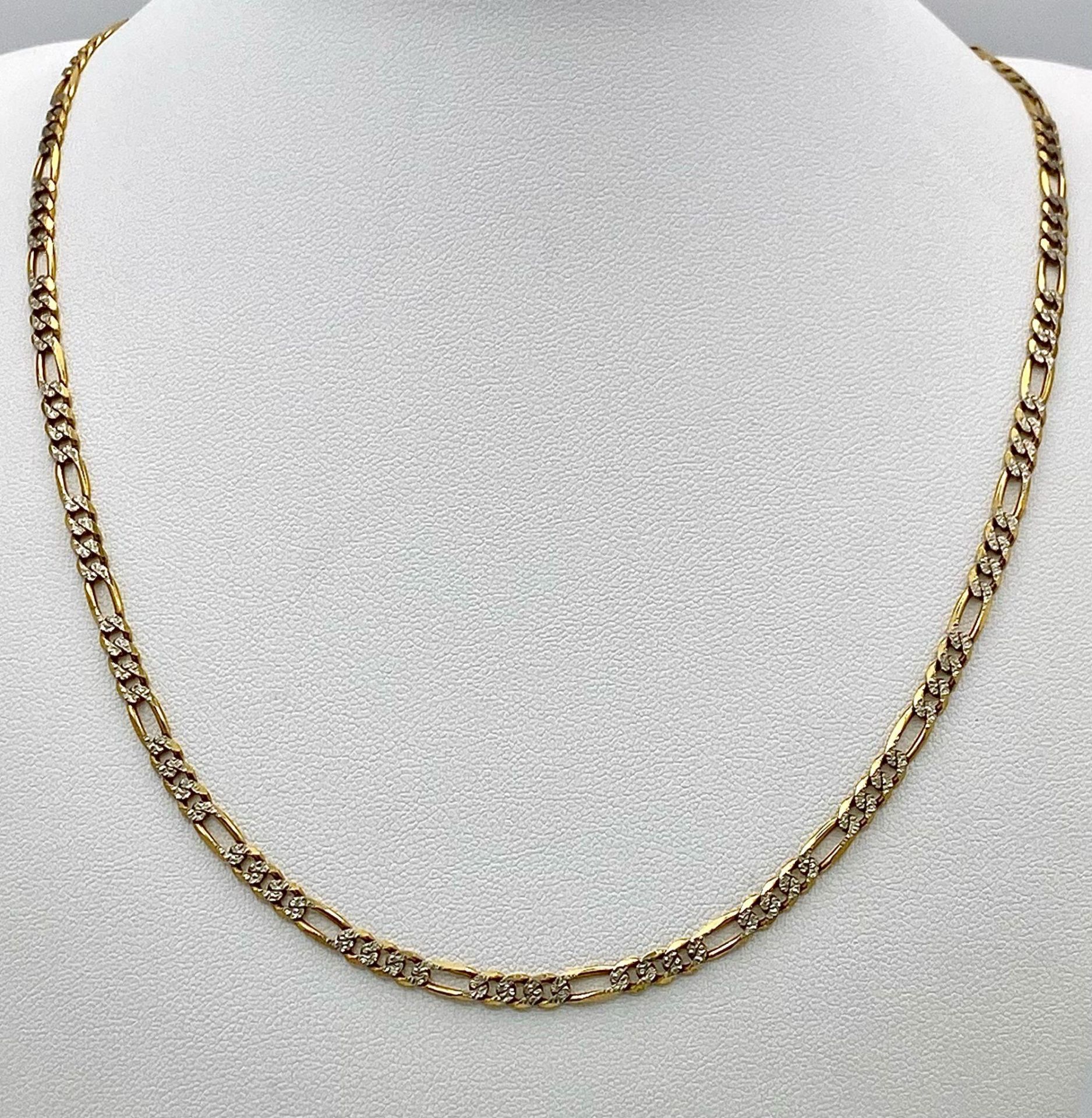 A 9K Yellow and White Gold Italian Figaro Link Necklace. 45cm length. 8.82g weight.