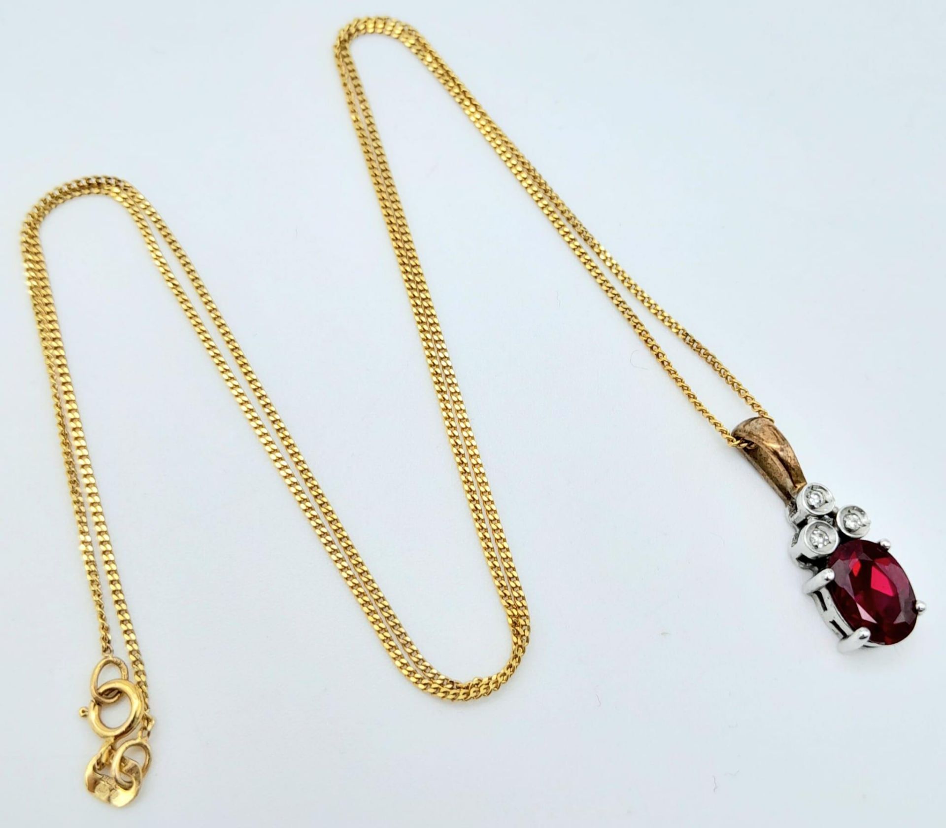 A 9K YELLOW GOLD DIAMOND & RED STONE PENDANT BELIEVED TO BE RUBY & 9K GOLD CHAIN 2.8G , 46cm length. - Image 3 of 6