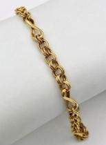 A Vintage 9K Yellow Gold Bracelet. Circle and twist links. 18cm length. 2.4g weight.