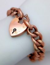 A Vintage 9K Rose Gold Curb Link Bracelet with Heart Clasp. 18cm. 17.21g weight.