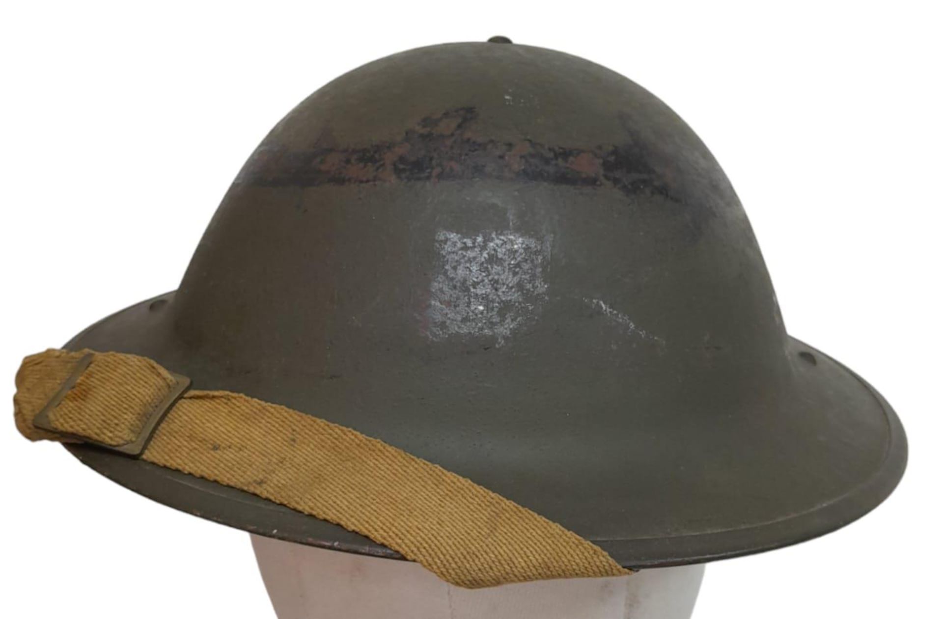 WW2 1943 Dated British Mk II Helmet, with insignia of the Gurkha Brigade. The makers stamp RO & CO