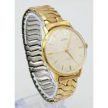 A Vintage Roamer Mechanical Gents Watch. Expandable gilded strap. Two tone stainless steel case -