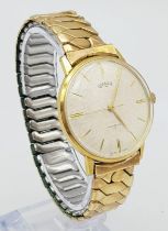 A Vintage Roamer Mechanical Gents Watch. Expandable gilded strap. Two tone stainless steel case -
