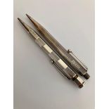 2 x Vintage SILVER PROPELLING PENCILS. To include a Hallmarked Johnson Matthey 1939. Together with a