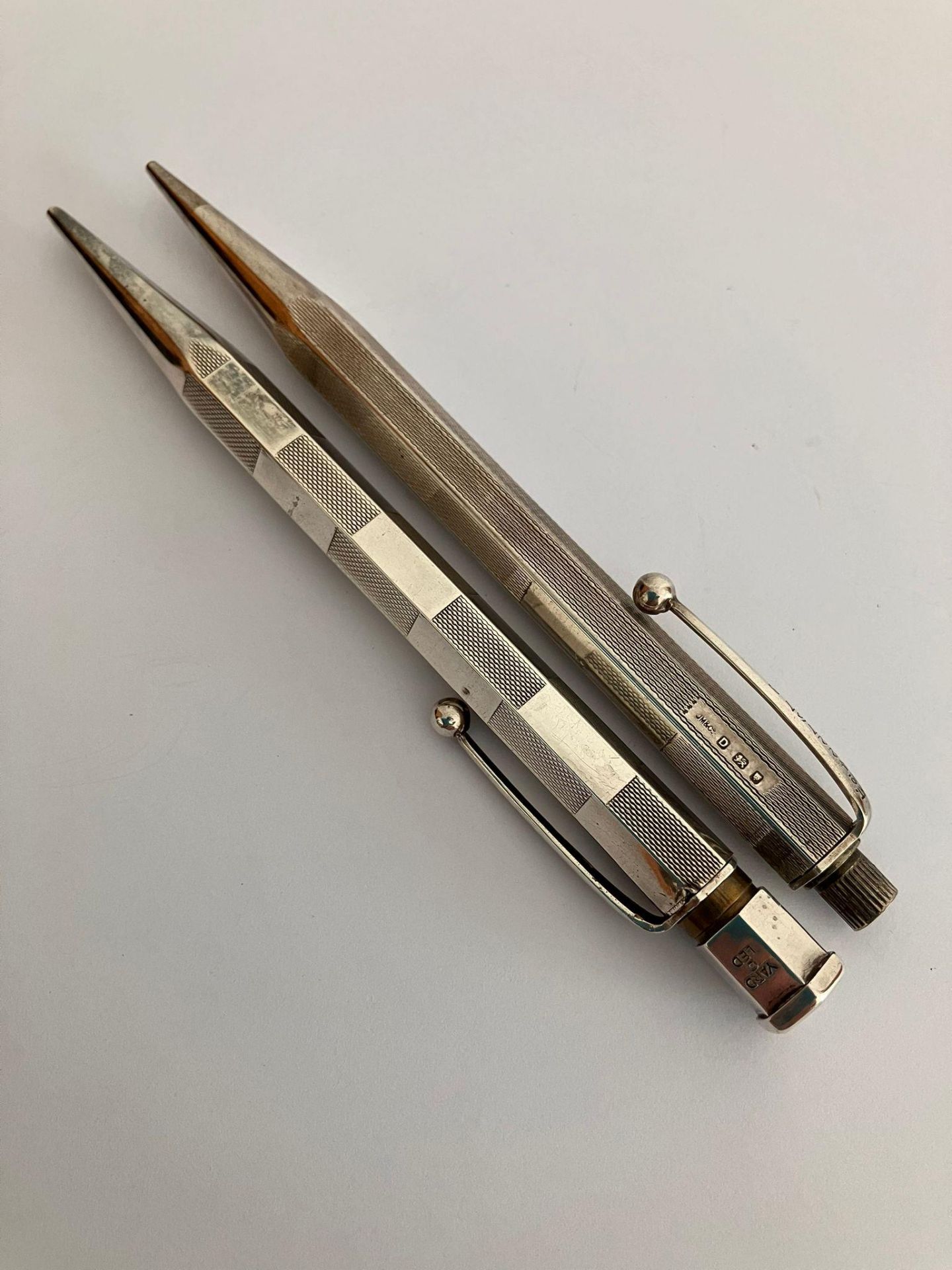 2 x Vintage SILVER PROPELLING PENCILS. To include a Hallmarked Johnson Matthey 1939. Together with a