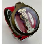 A Verticale Mechanical Top Winder Unisex Watch. Bright red textile strap. Rose gold tone ceramic