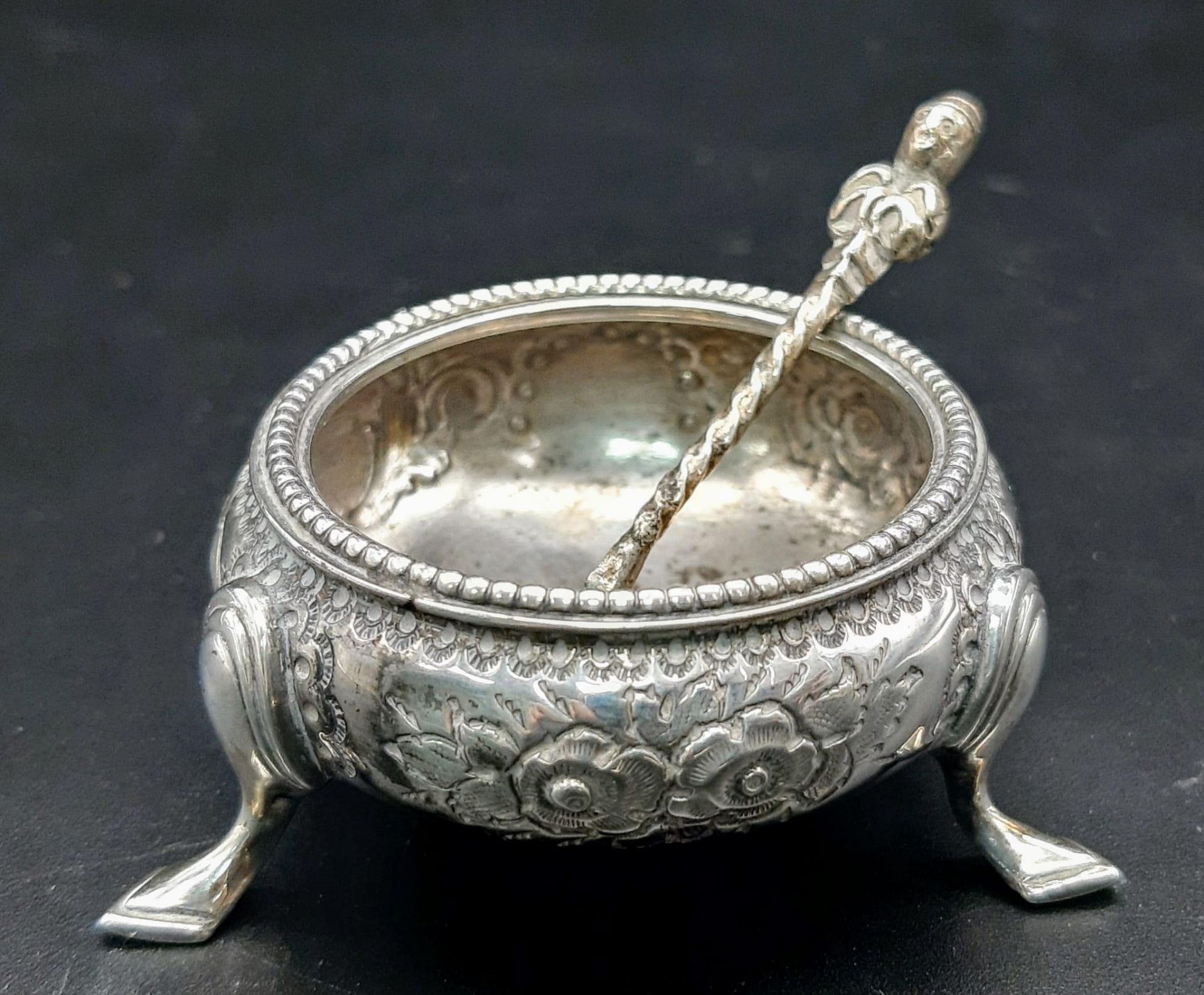 A set of Victorian antique sterling silver salt cellar with nicely floral ornate and silver spoon