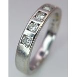 An 18K White Gold Diamond Half-Eternity Ring. 0.25ctw of diamonds. Size L/M. 3.95g total weight.