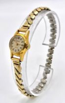 A VINTAGE 18K GOLD MUDU LADIES WRISTWATCH ON A GOLD PLATED EXPANDABLE STRAP , IN GOOD WORKING