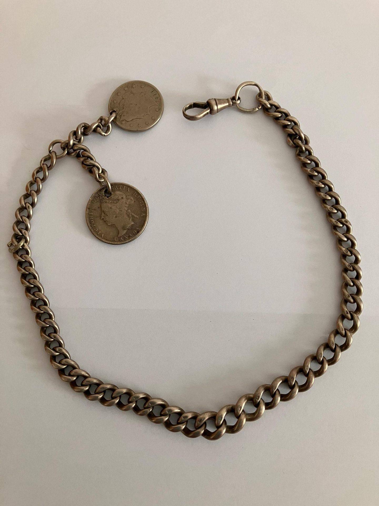 Antique SOLID SILVER ALBERT WATCH CHAIN. Complete with two antique silver coin fobs, To include a
