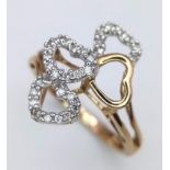 A 9K YELLOW GOLD 4 HEARTS RING, WITH DIAMONDS SET SURROUND THE HEART. 2.4G SIZE N SC 4044