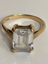 9 carat YELLOW GOLD RING Having 1.5 carat Emerald Cut Cubic Zirconia set to top. Full UK hallmark.