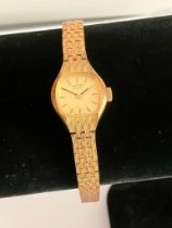 Ladies Vintage ROTARY WRISTWATCH. Finished in gold tone with integral bracelet strap. Complete