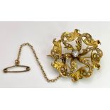 An Antique 10K Yellow Gold Diamond and Seed Pearl Brooch. 0.25ct brilliant round cut diamond