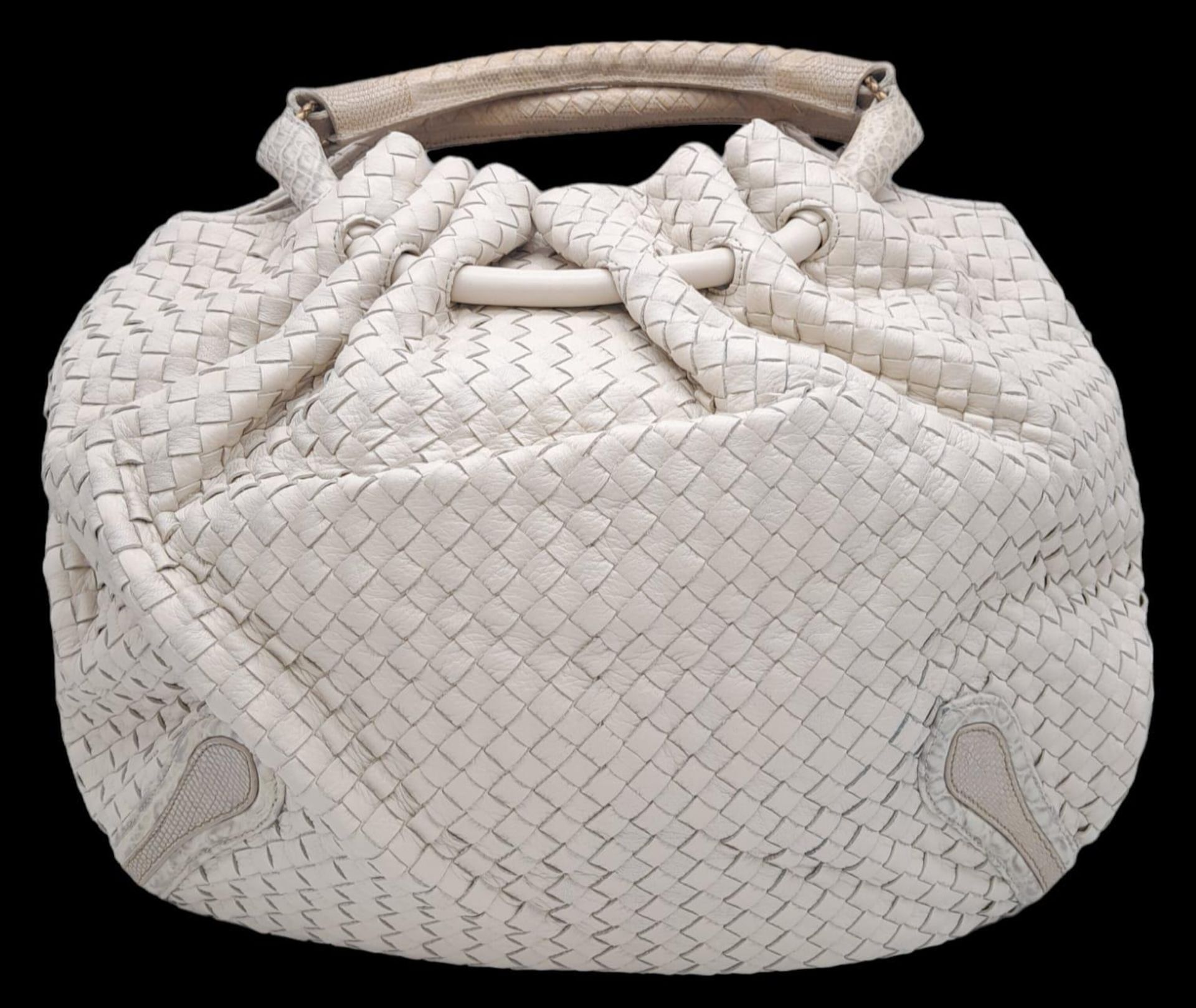 A Bottega Veneta Cream Hobo Bag. Intracciato (woven) leather exterior with reptilian handles and
