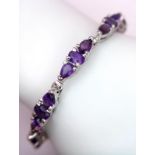 An Amethyst Tennis Bracelet on 925 Silver. 19cm length, 18.6g total weight. Ref: CD-1206