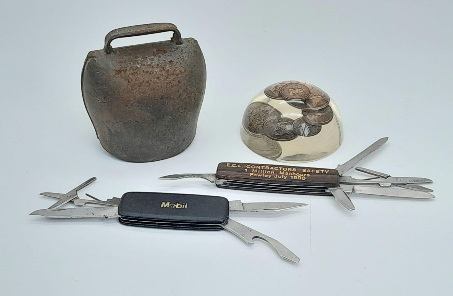 A Nice Vintage Bundle: Old coin paperweight, 2 penknives and a cowbell!