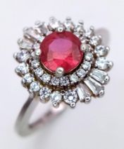 A STUNNING RUBY AND DIAMOND RING SET IN SILVER . 3.4gms size O