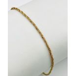 A 9K Yellow Gold Thin Rope Bracelet. 18cm. 1.12g weight.