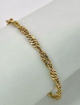 A 14K Yellow Gold Intricate Link Bracelet. 17cm. 2g weight.