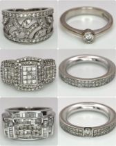 A Six Ring 18K White Gold Bonanza! To include: (1) Diamond half eternity with centre diamond -