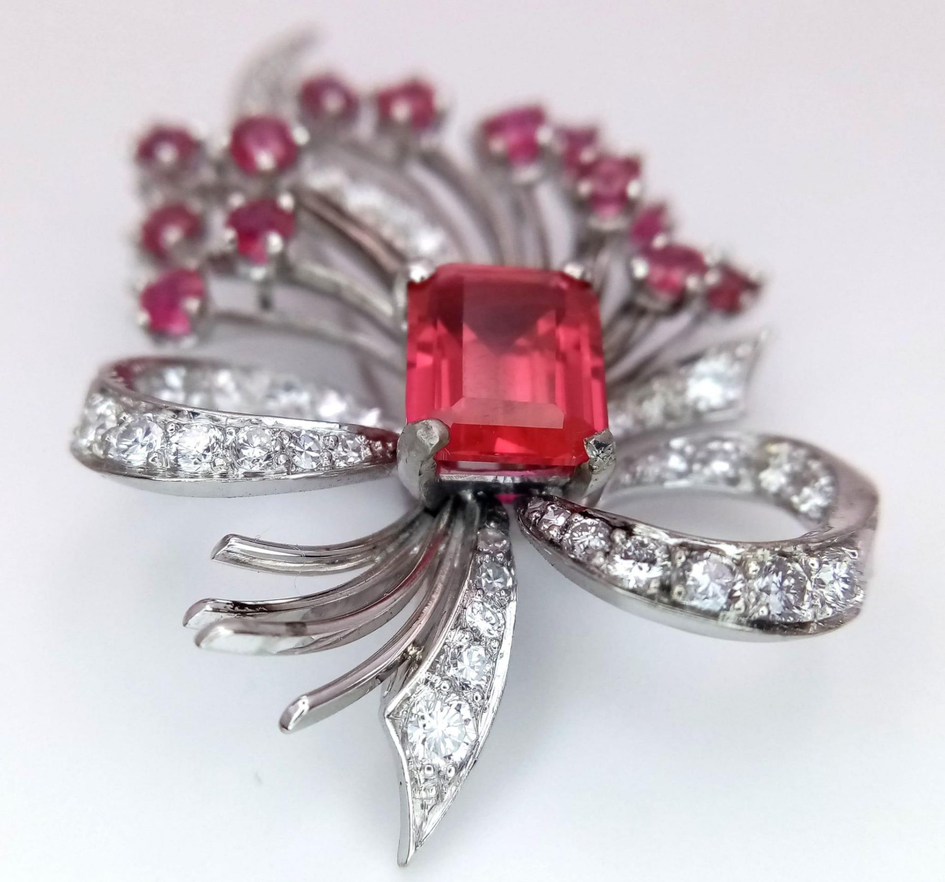 A STUNNING DIAMOND AND RUBY BROOCH SET IN PLATINUM , A MAJESTIC SPRAY OF RUBIES EMINATING FROM A - Image 3 of 7