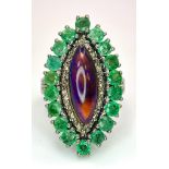 A Black Opal Ring with an Emerald and Diamond Surround on 925 Silver. 2.3ctw emeralds, 0.40ctw