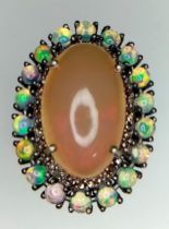 An Opal Ring with Diamond and Opal Surround on 925 Silver. 8.70ct centre stone (2cm), 2.10ctw opal