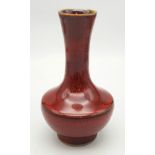 A Chinese Iron-Rust Glazed Bottle Vase. Covered all over in a reddish-brown glaze speckled with