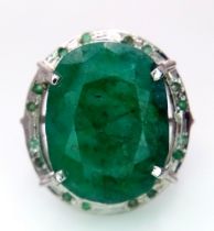 An Oval Shape Brazilian Emerald 925 Silver Ring with Emeralds Accents. Weight - 17g total. 60ctw