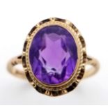 A VINTAGE 9K YELLOW GOLD AMETHYST RING - 2.4CT FACETED OVAL AMETHYST SOLITAIRE STONE- 2.3G TOTAL