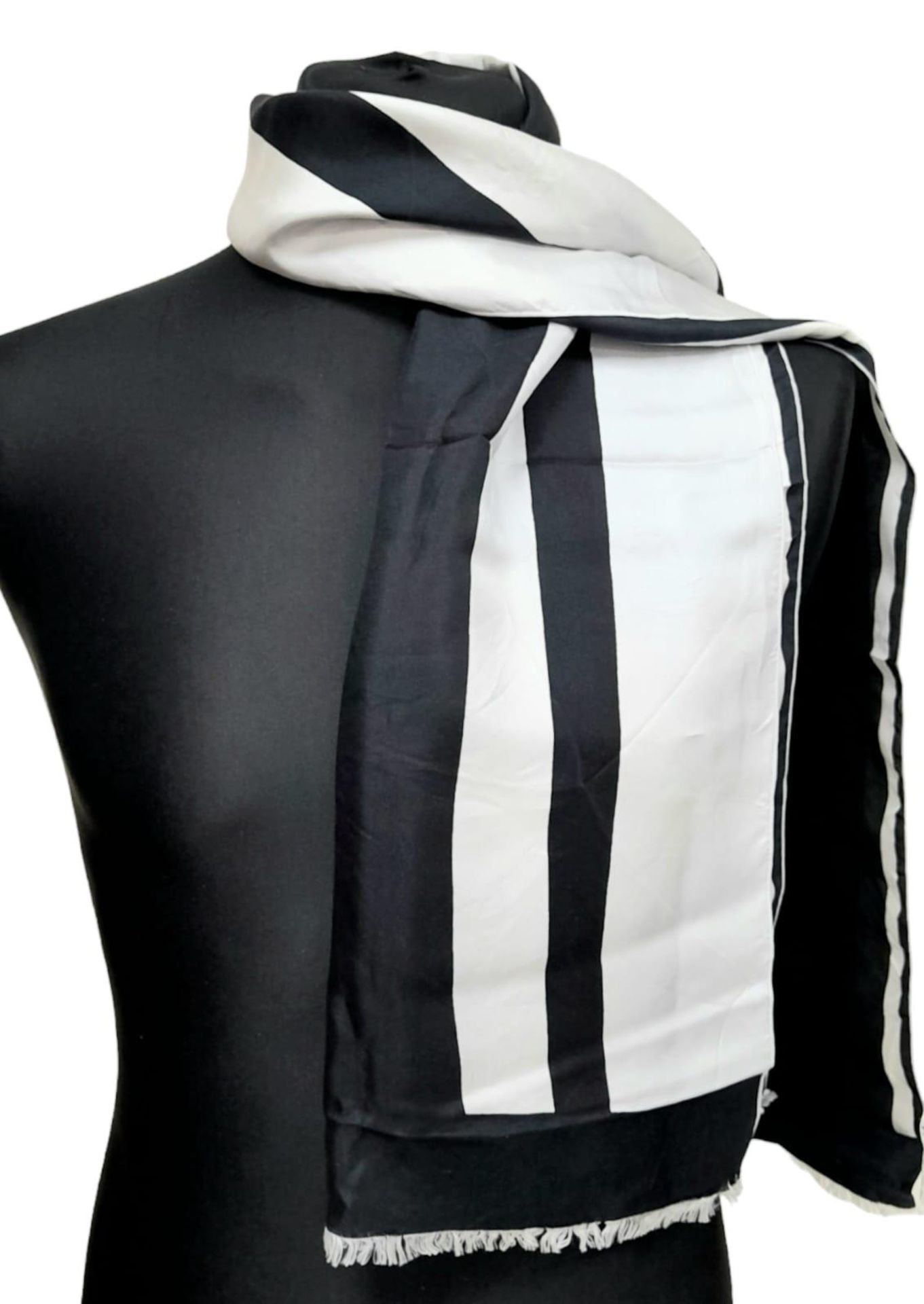 A Pierre Cardin Black and White Stripe Scarf. 153cm x 40cm. Please see photos for condition. ref