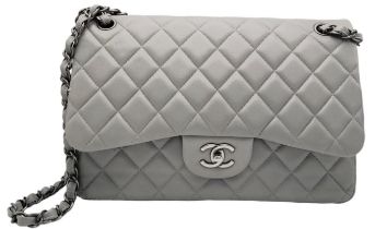 A Chanel Grey Caviar Jumbo Classic Double Flap Bag. Quilted leather exterior with silver and
