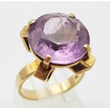 A Vintage 9K Yellow Gold Amethyst Ring. 10ct round cut amethyst set in a raised foundation. Size